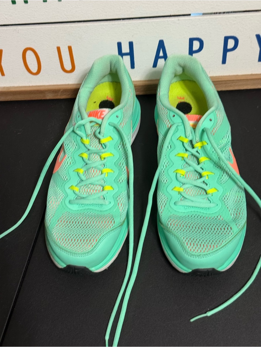 Nike Women’s Mint Green Athletic Running Shoes with Coral Swoosh